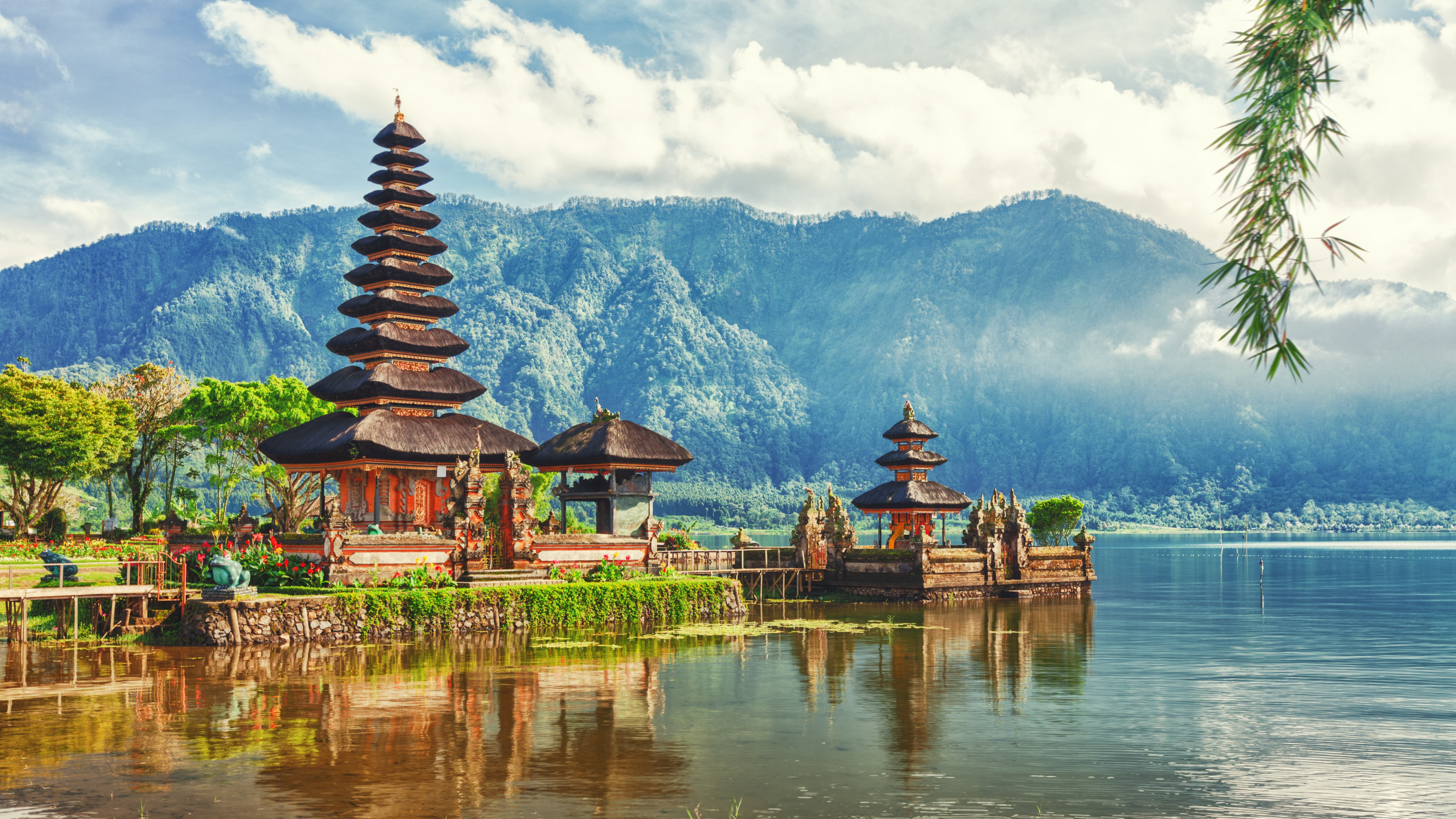 Brown and Green Temple Near Body of Water and Green Mountain During Daytime. Wallpaper in 3840x2160 Resolution