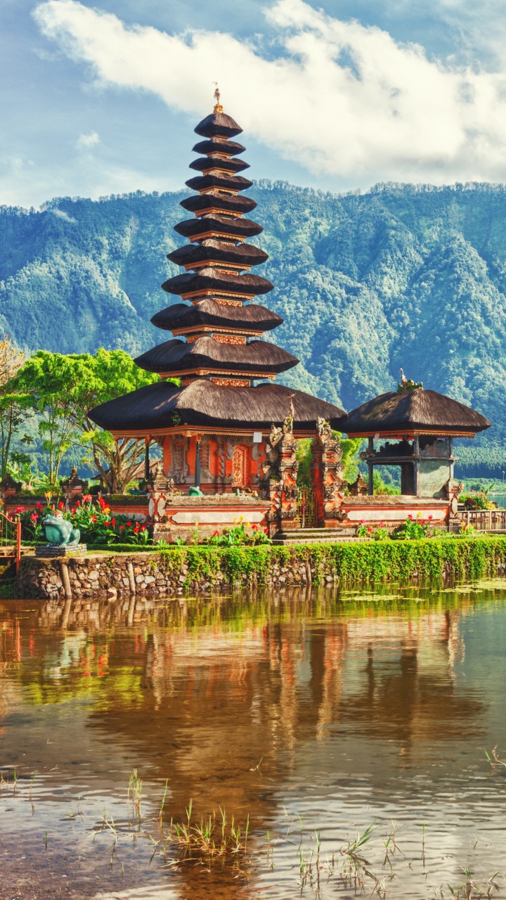 Brown and Green Temple Near Body of Water and Green Mountain During Daytime. Wallpaper in 720x1280 Resolution