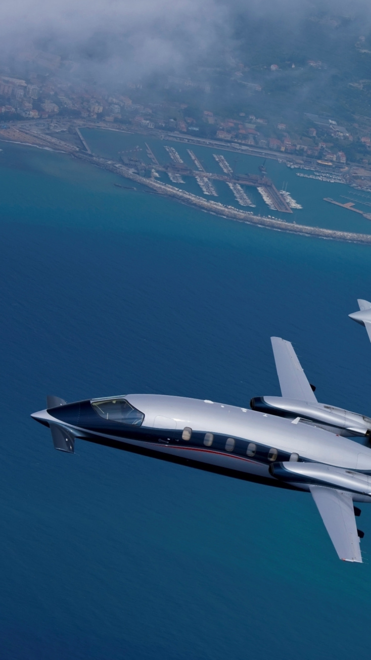 White and Black Jet Plane. Wallpaper in 750x1334 Resolution