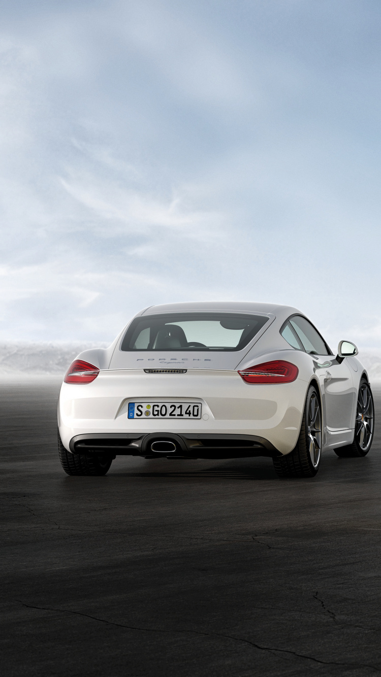 Porsche 911 Amarillo Sobre Pavimento Gris. Wallpaper in 750x1334 Resolution