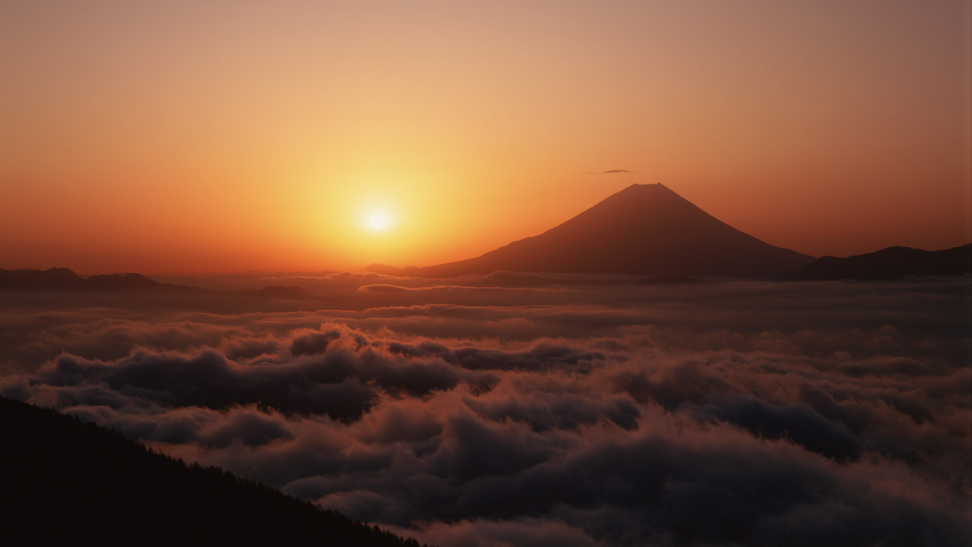 Clouds and Mountains During Sunset. Wallpaper in 1366x768 Resolution