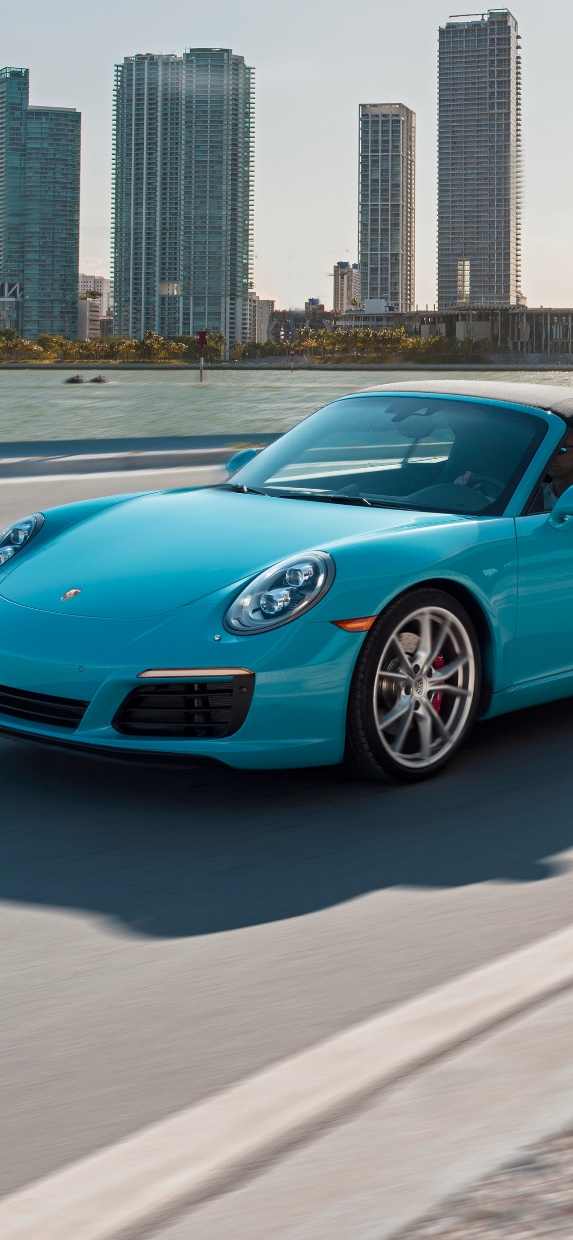 Blue Porsche 911 on Road During Daytime. Wallpaper in 1125x2436 Resolution