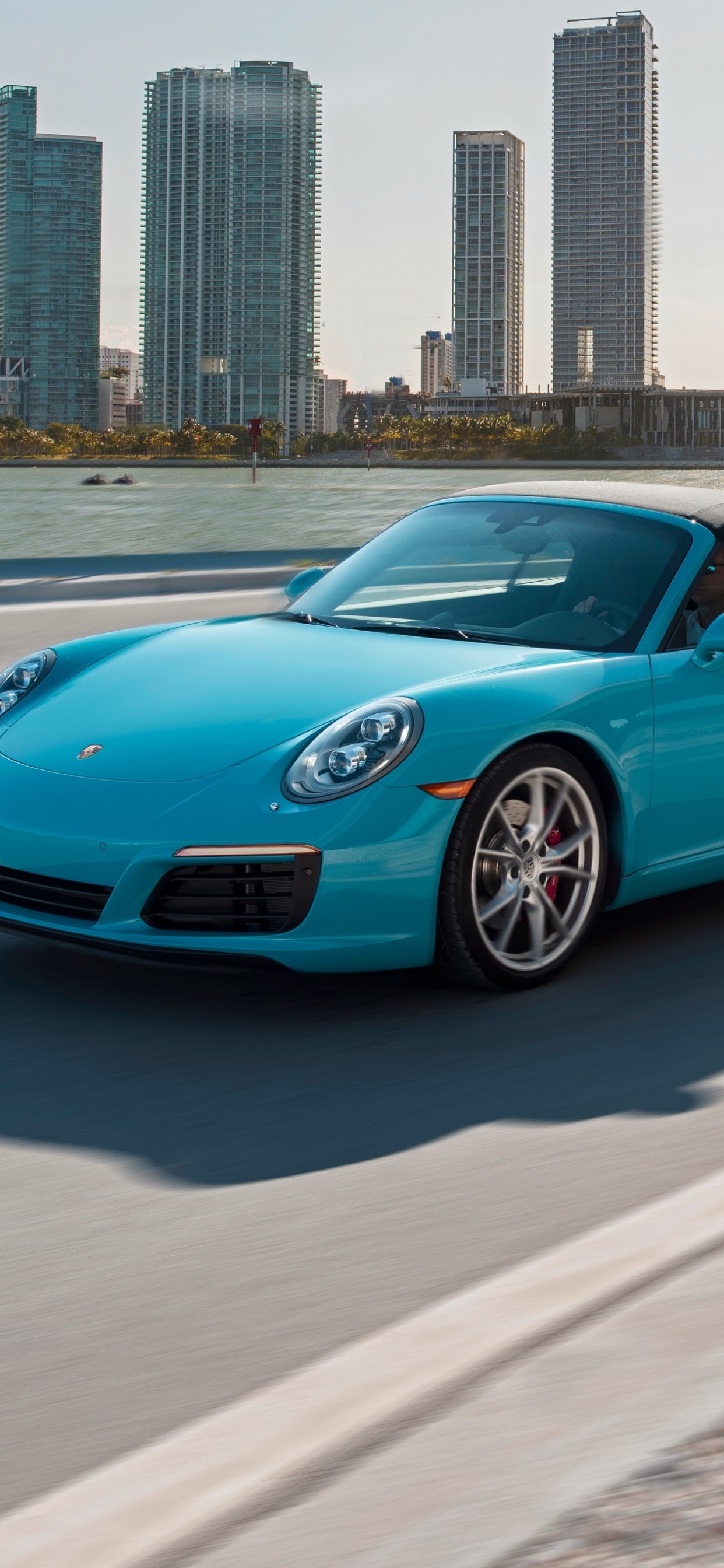 Blue Porsche 911 on Road During Daytime. Wallpaper in 1242x2688 Resolution