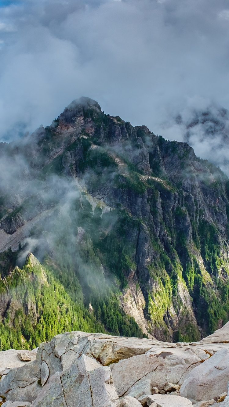 Green and Brown Mountain Under White Clouds During Daytime. Wallpaper in 750x1334 Resolution
