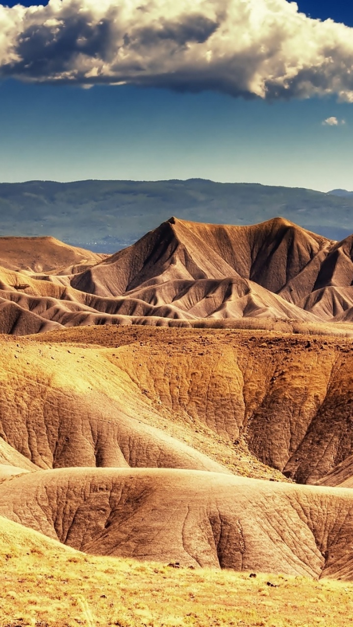 Brown Mountain Under Blue Sky During Daytime. Wallpaper in 720x1280 Resolution
