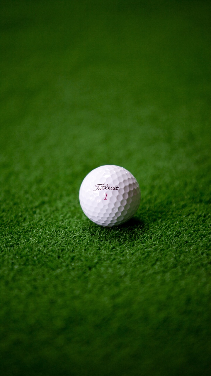 White Golf Ball on Green Grass. Wallpaper in 720x1280 Resolution