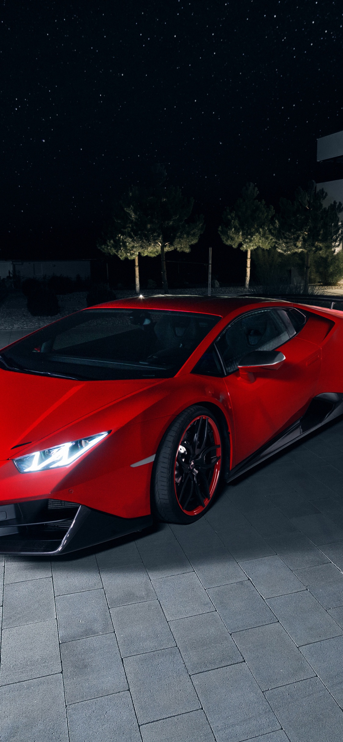 Roter Ferrari 458 Italia Auf Grauem Betonpflaster Geparkt. Wallpaper in 1125x2436 Resolution