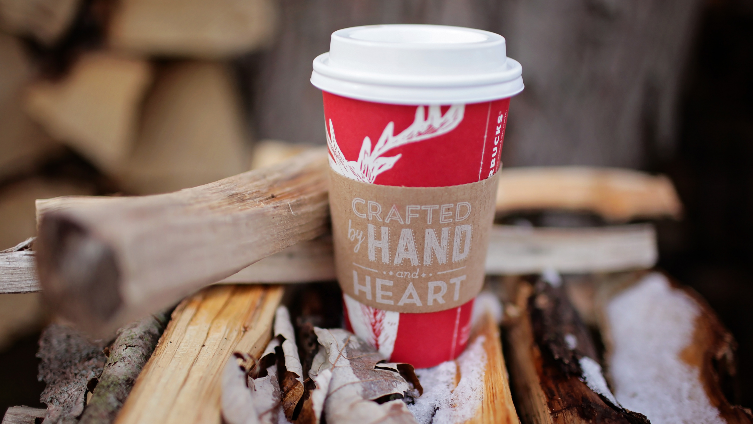 Red and White Disposable Cup on Brown Wooden Table. Wallpaper in 2560x1440 Resolution