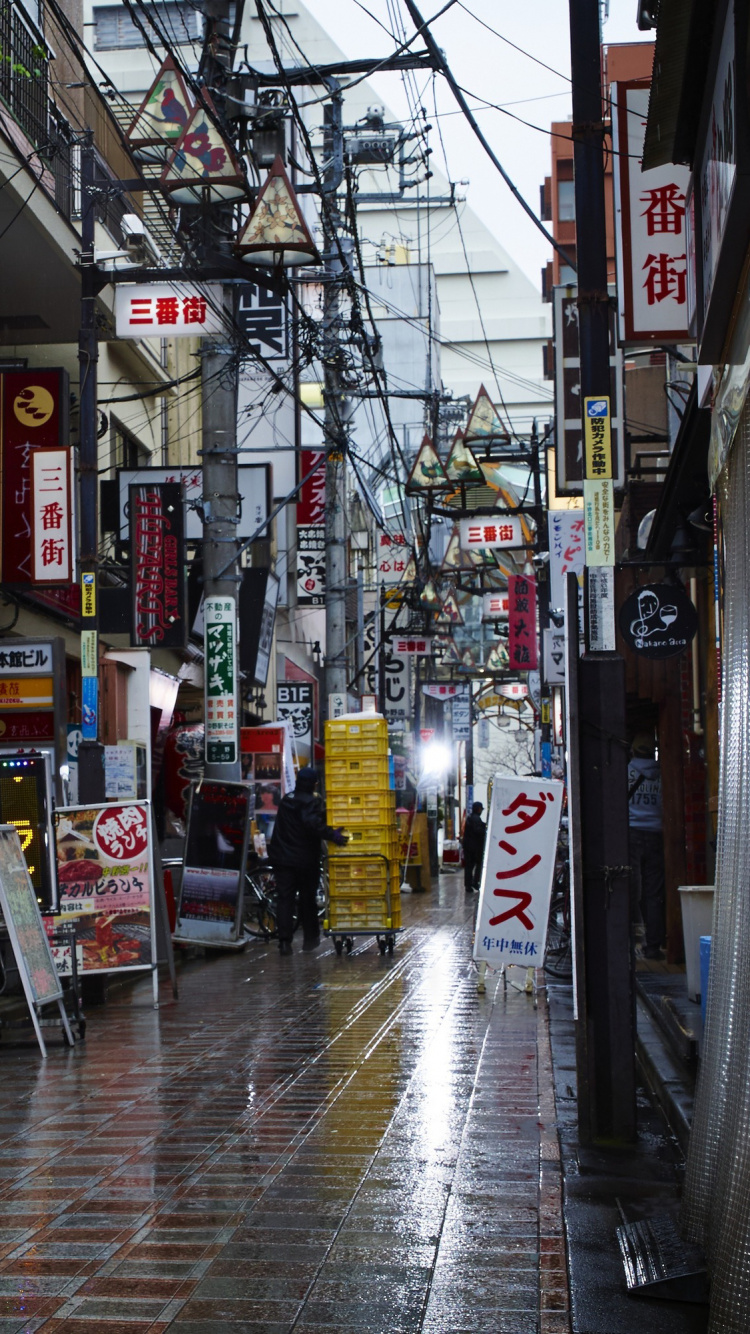 Man in White and Blue Jacket Walking on Sidewalk During Daytime. Wallpaper in 750x1334 Resolution