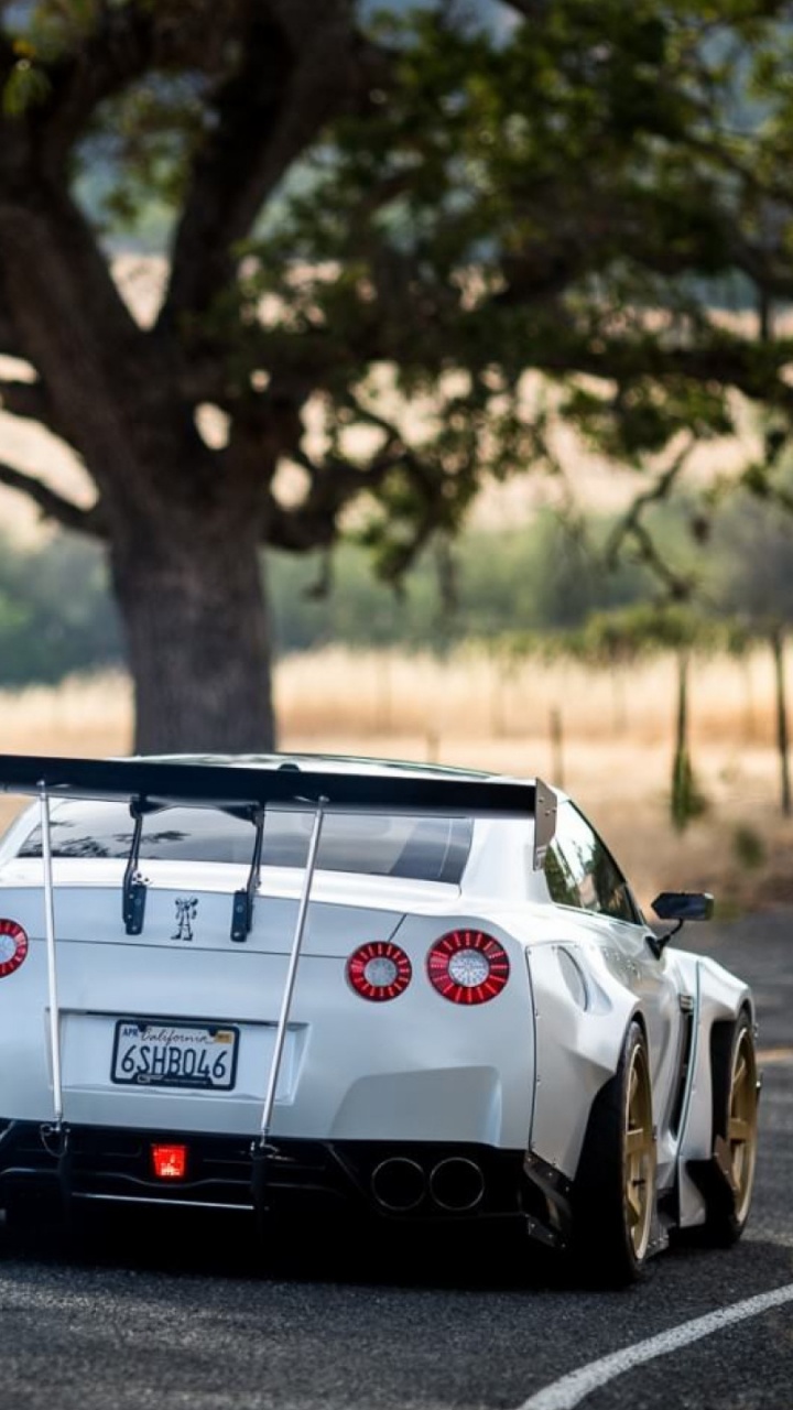 White and Black Porsche 911 on Road During Daytime. Wallpaper in 720x1280 Resolution