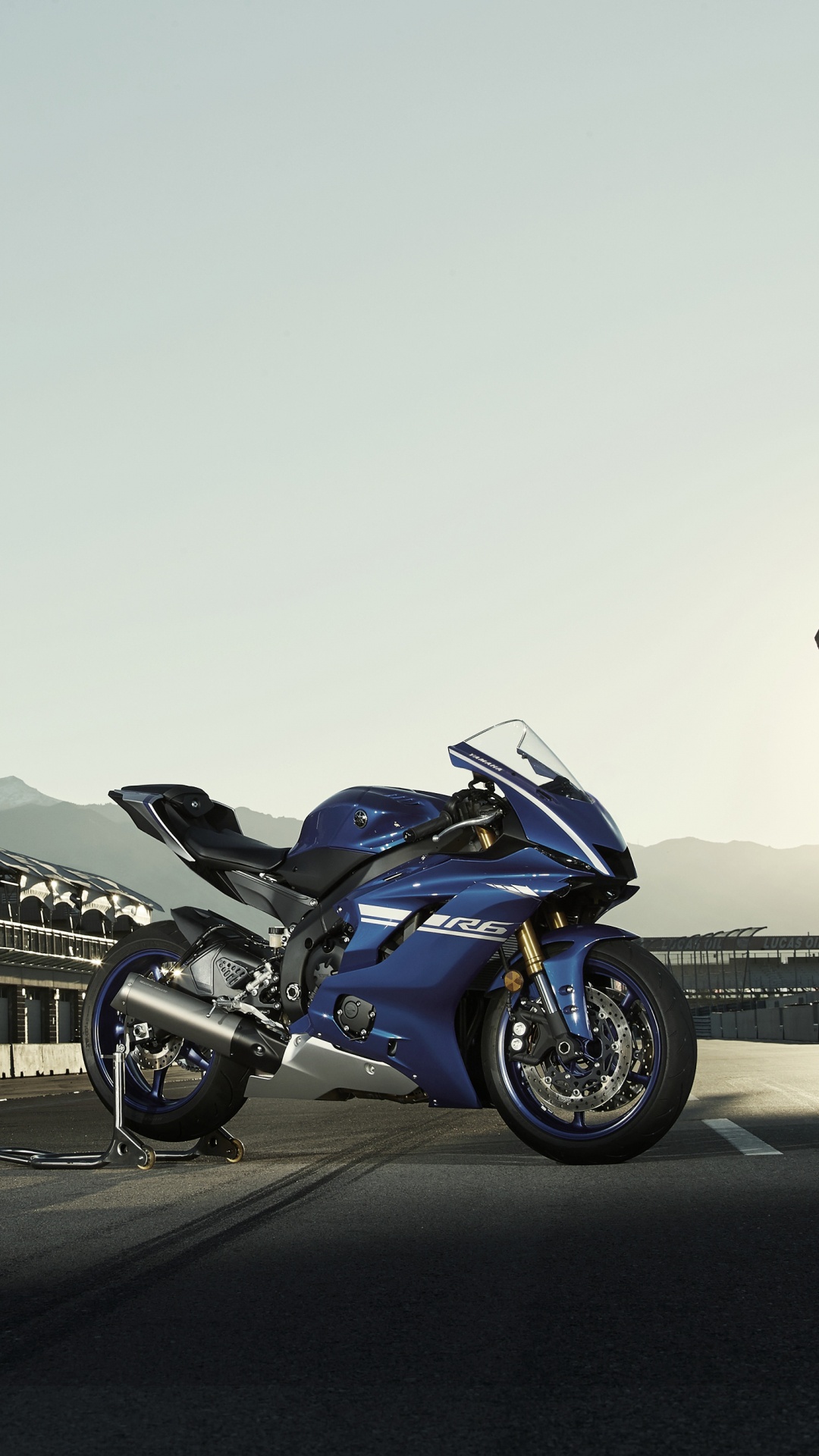 Blue and Black Sports Bike Parked on Gray Concrete Road During Daytime. Wallpaper in 1080x1920 Resolution