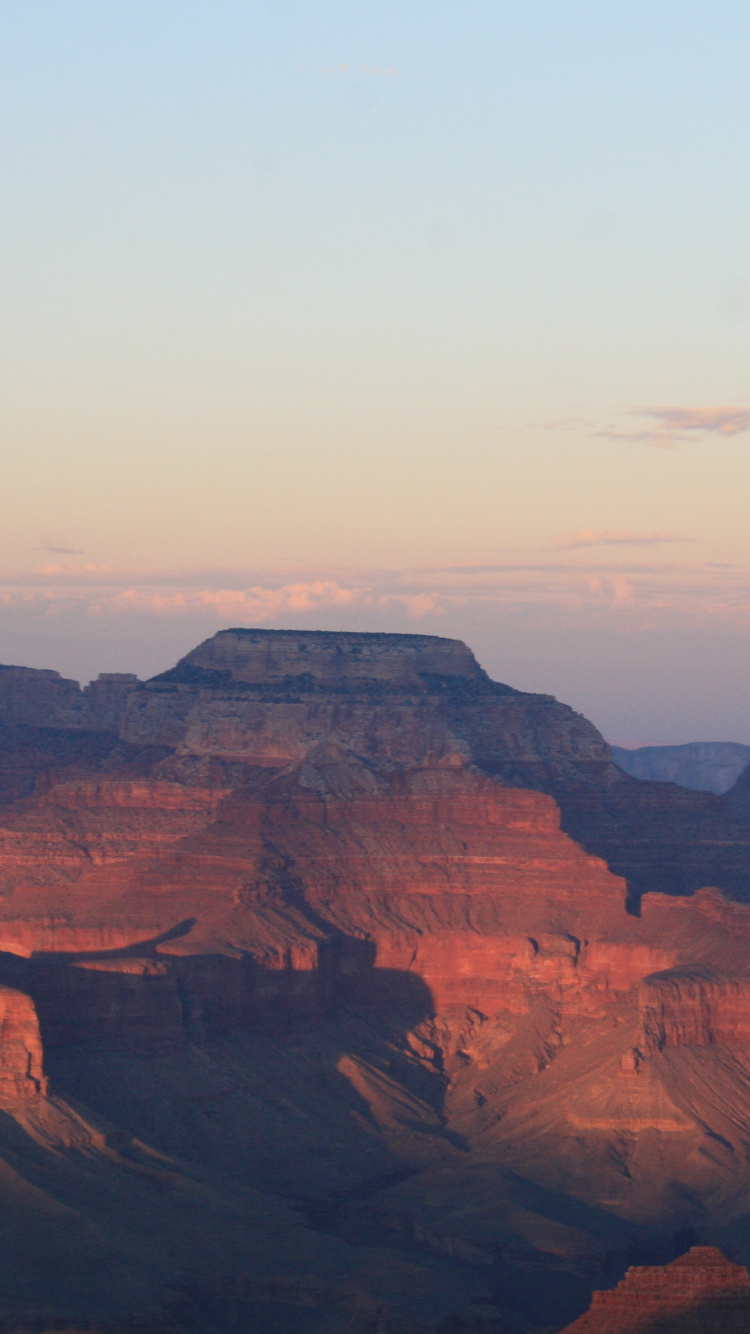 Brown Rock Formation Under White Sky During Daytime. Wallpaper in 750x1334 Resolution