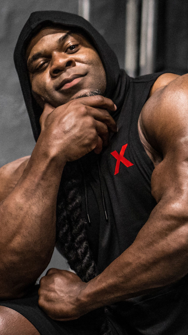 Man in Black and Red Nike Jersey Shirt. Wallpaper in 750x1334 Resolution