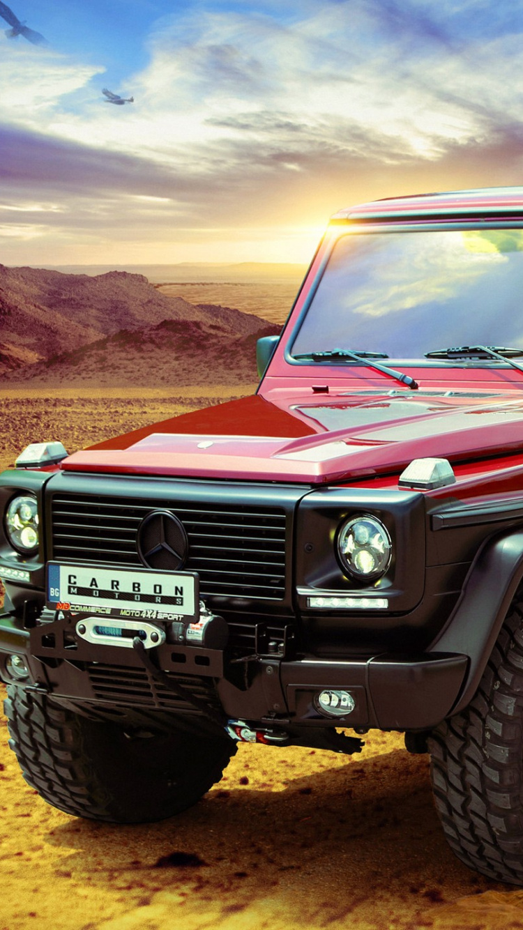 Roter Jeep Wrangler Auf Braunem Sand Tagsüber. Wallpaper in 750x1334 Resolution