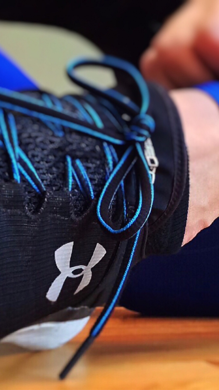 Person Wearing Blue and Black Nike Athletic Shoes. Wallpaper in 750x1334 Resolution