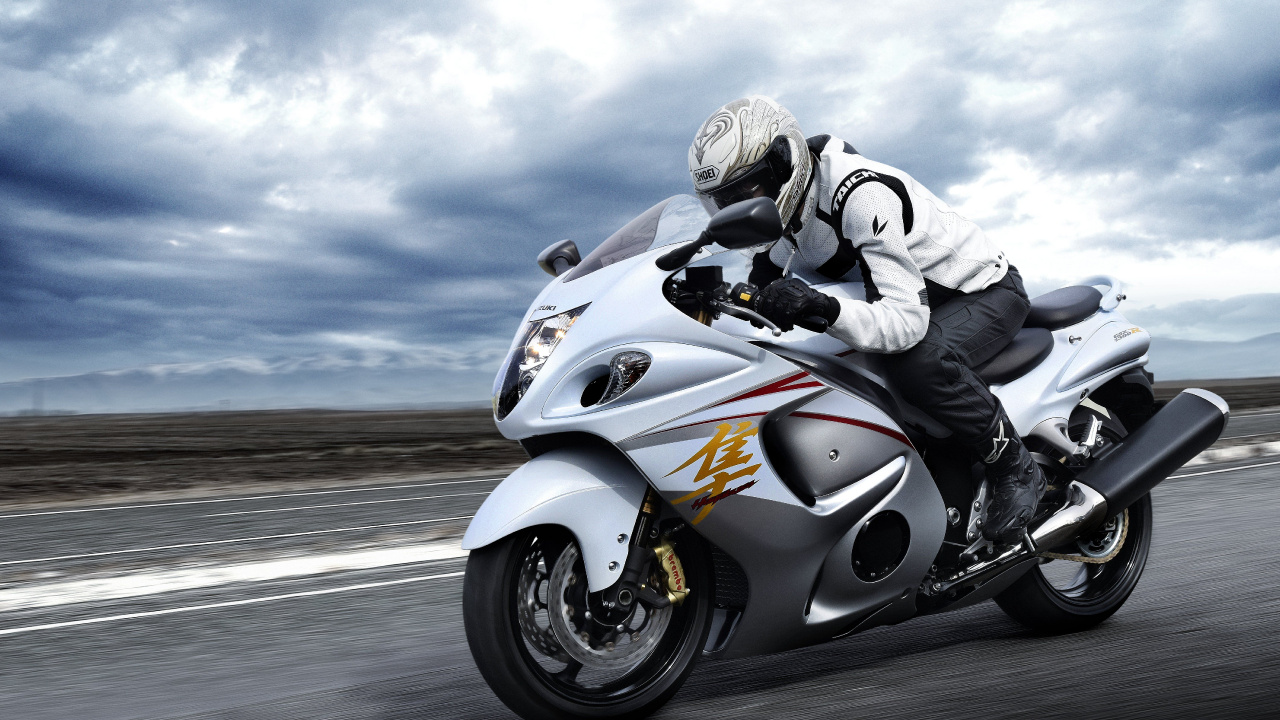 Man Riding White Sports Bike on Road During Daytime. Wallpaper in 1280x720 Resolution
