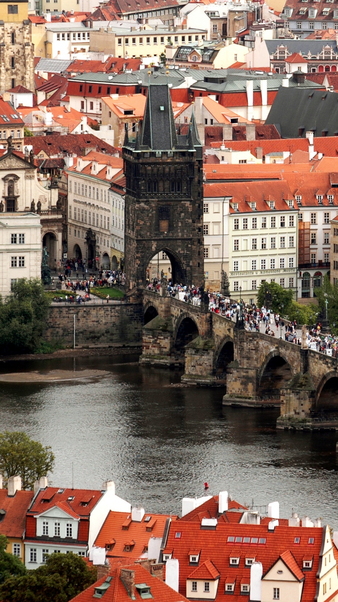 Red and White Concrete Building Near River During Daytime. Wallpaper in 1080x1920 Resolution