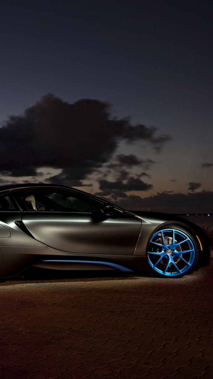 Black Coupe Parked on Dock During Night Time. Wallpaper in 720x1280 Resolution