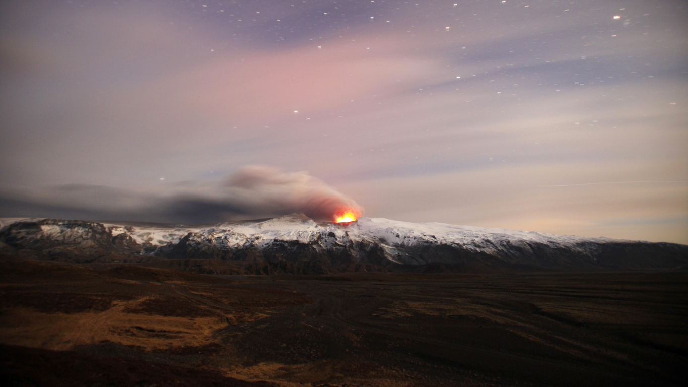 Brown Mountain Under Blue Sky During Night Time. Wallpaper in 1366x768 Resolution