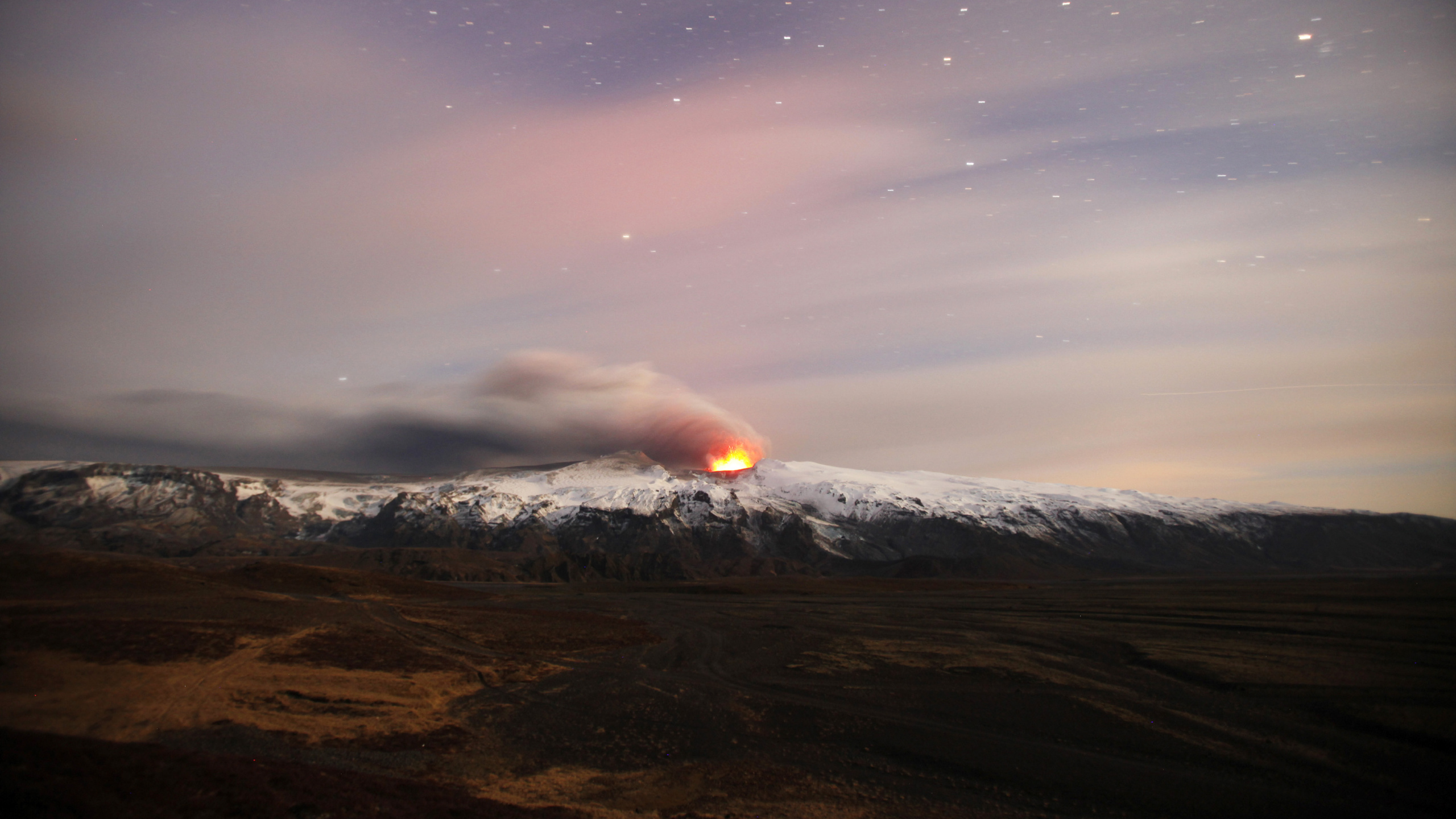 Brown Mountain Under Blue Sky During Night Time. Wallpaper in 2560x1440 Resolution