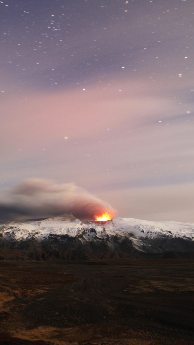 Brown Mountain Under Blue Sky During Night Time. Wallpaper in 750x1334 Resolution