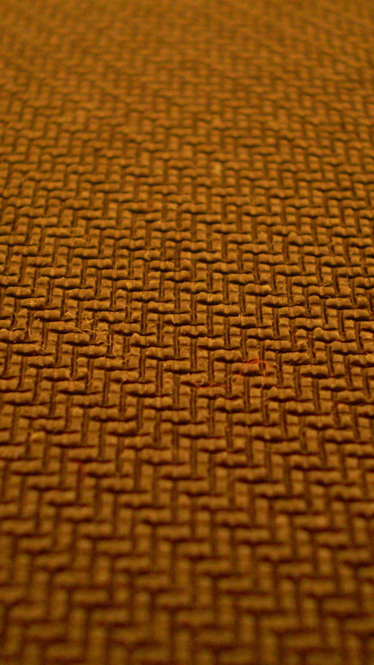 Braunes Und Schwarzes Gepunktetes Textil. Wallpaper in 750x1334 Resolution