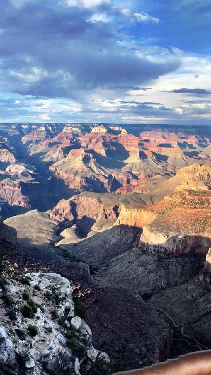 Brown and Black Mountains Under White Clouds and Blue Sky During Daytime. Wallpaper in 720x1280 Resolution