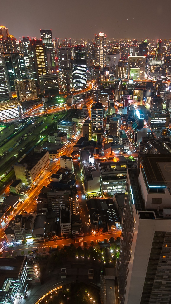 Vue Aérienne de la Ville Pendant la Nuit. Wallpaper in 720x1280 Resolution