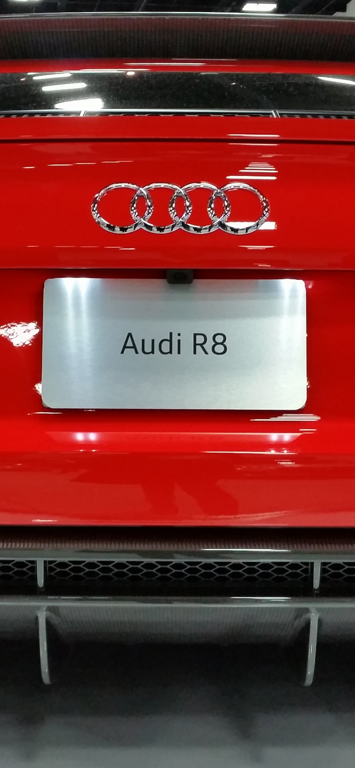 Red Porsche 911 Parked on Black Metal Frame. Wallpaper in 1242x2688 Resolution