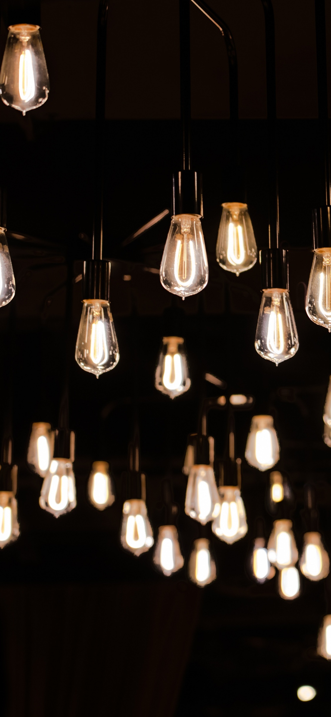 Lighted Pendant Lamps in Dark Room. Wallpaper in 1125x2436 Resolution