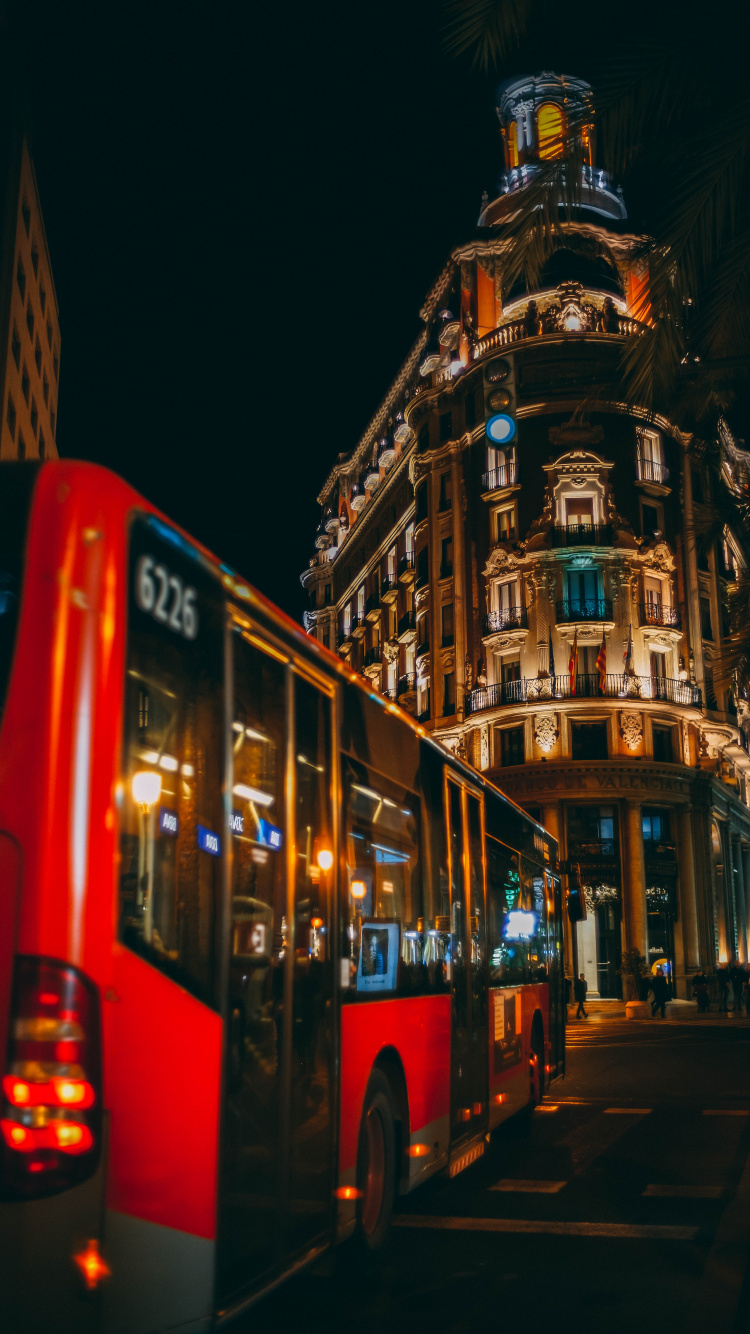 Red Double Decker Bus on Road During Night Time. Wallpaper in 750x1334 Resolution
