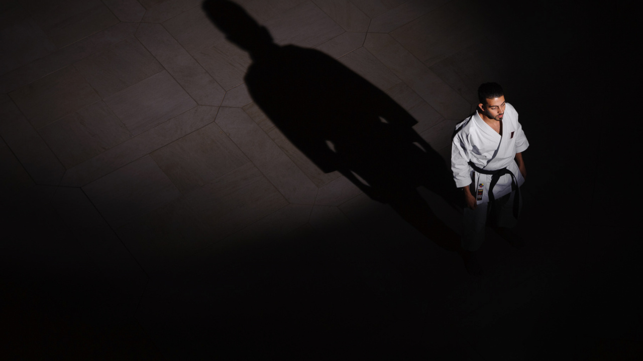 Man in White Dress Shirt and Black Pants Walking on White Floor Tiles. Wallpaper in 1280x720 Resolution