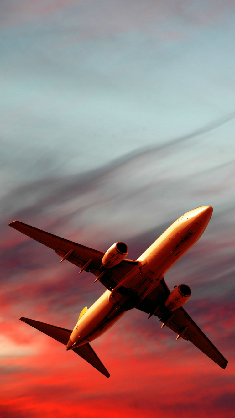 White Airplane in Mid Air. Wallpaper in 750x1334 Resolution