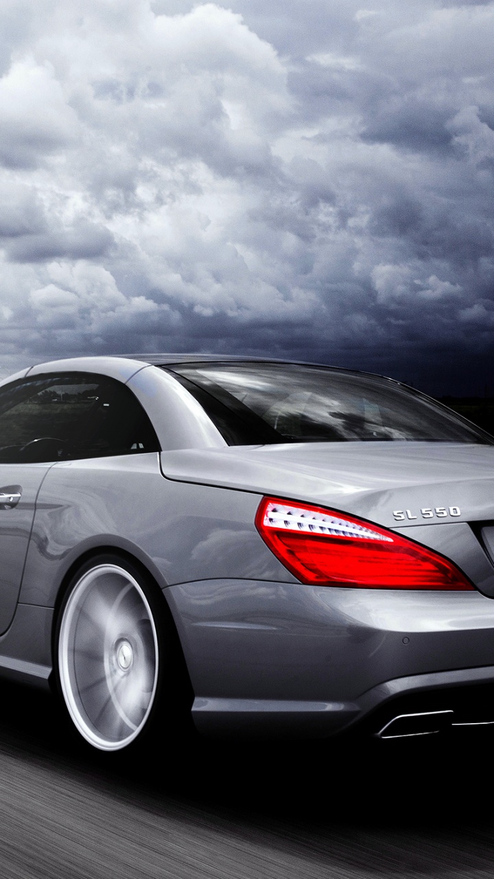 Grauer Porsche 911 Unterwegs. Wallpaper in 720x1280 Resolution