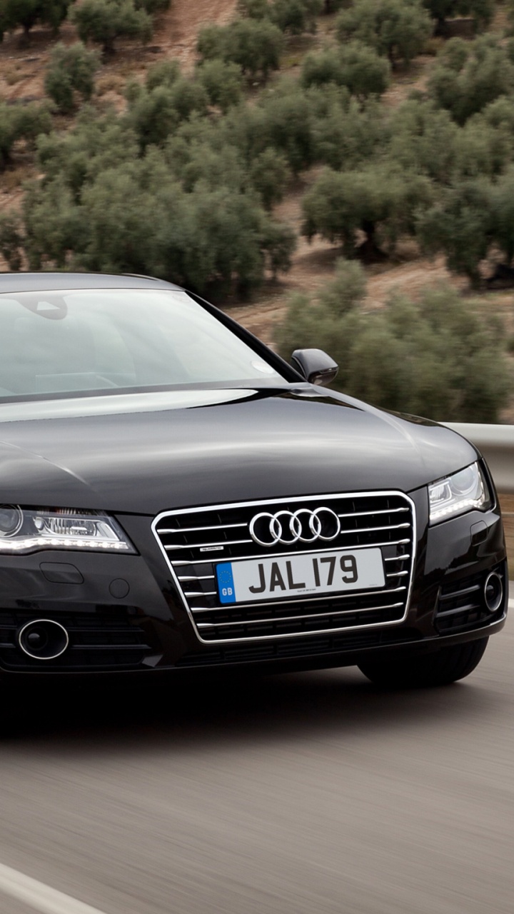 Coupé Audi Noir Sur Route Pendant la Journée. Wallpaper in 720x1280 Resolution