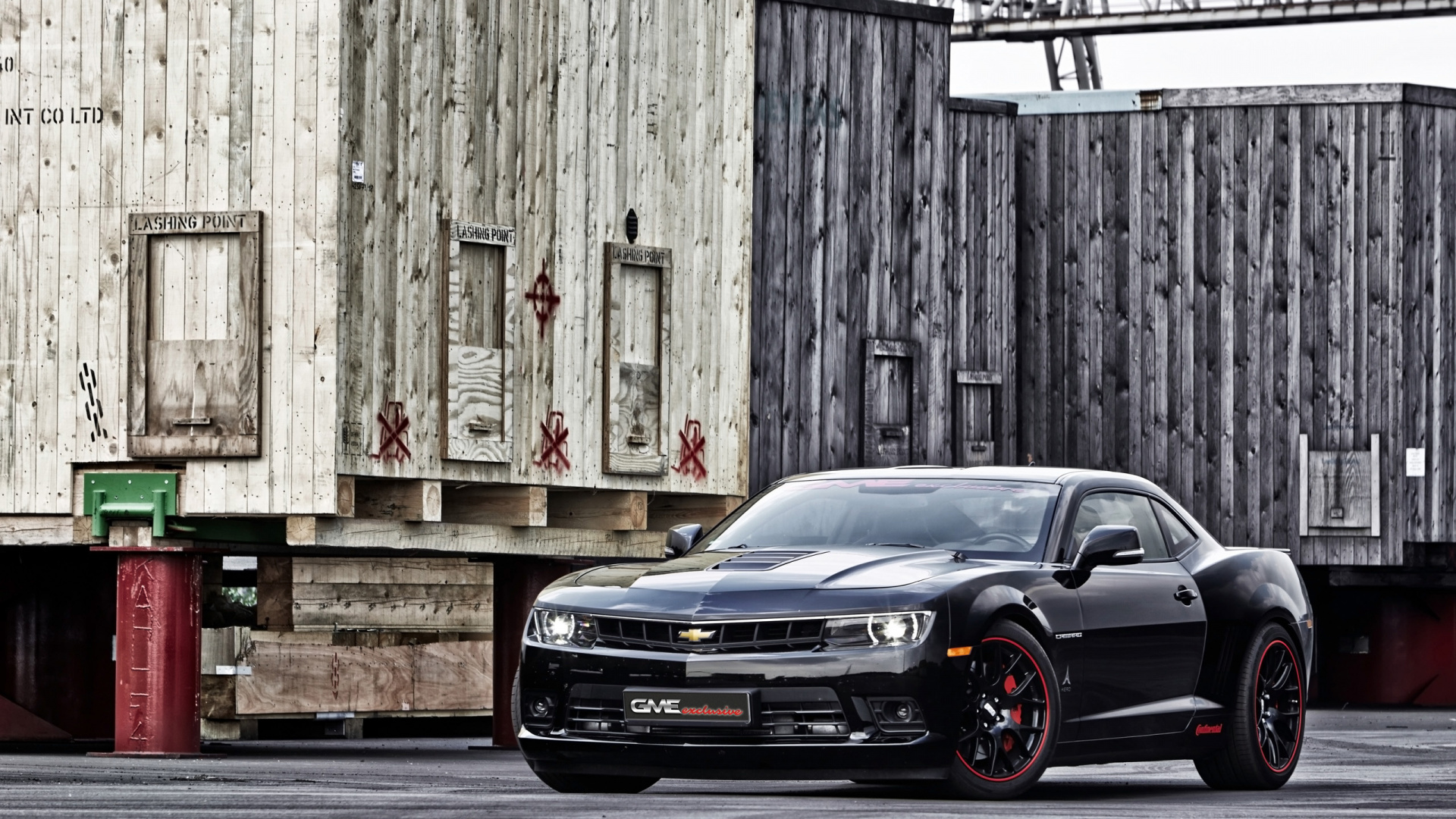 Black Car Parked Beside Brown Wooden Wall. Wallpaper in 1920x1080 Resolution