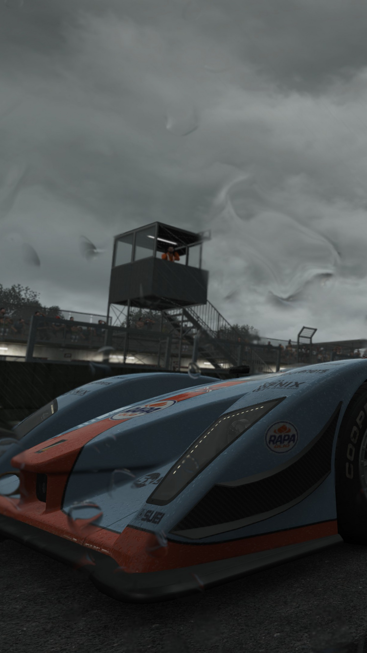 Ferrari F 1 Negro y Rojo Sobre Arena Gris Bajo un Cielo Nublado Gris Durante el Día. Wallpaper in 750x1334 Resolution