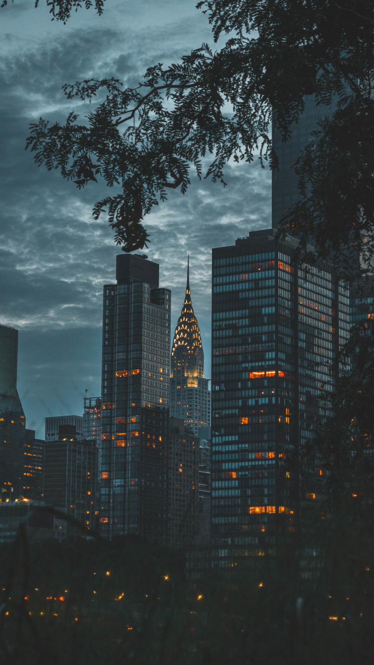 High Rise Buildings Under Gray Clouds. Wallpaper in 750x1334 Resolution