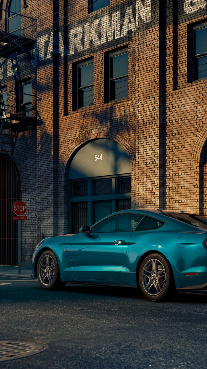 Blue Sedan Parked Beside Brown Concrete Building During Daytime. Wallpaper in 720x1280 Resolution