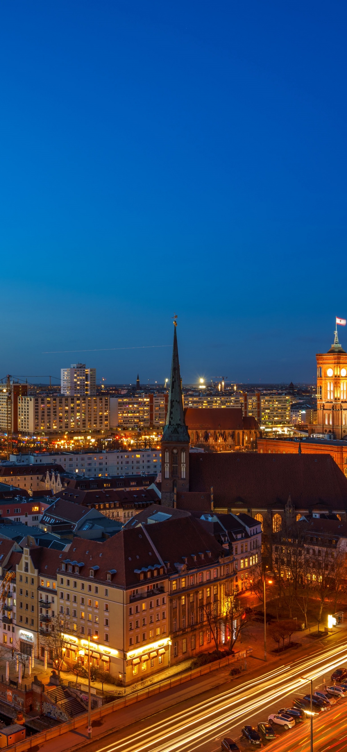 City Skyline During Night Time. Wallpaper in 1125x2436 Resolution