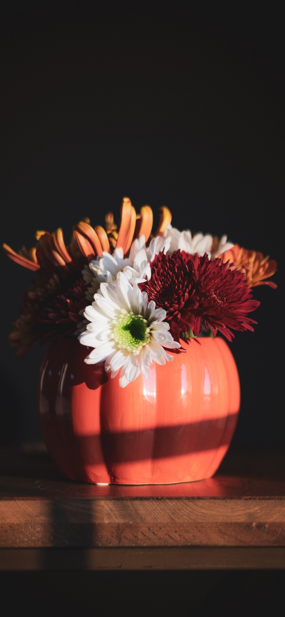 Red and White Flower in Orange Ceramic Vase on Brown Wooden Table. Wallpaper in 1125x2436 Resolution