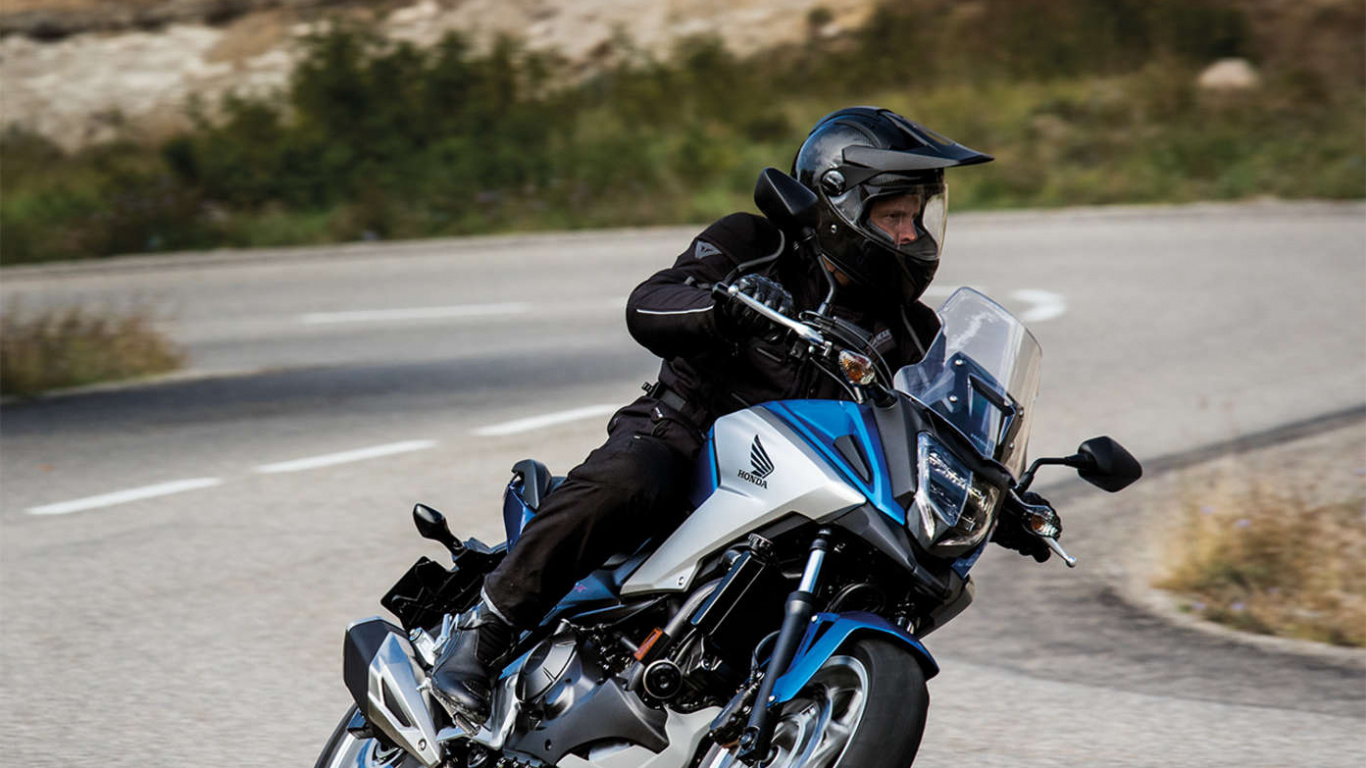 Man in Black Jacket Riding on Black Motorcycle on Road During Daytime. Wallpaper in 1366x768 Resolution
