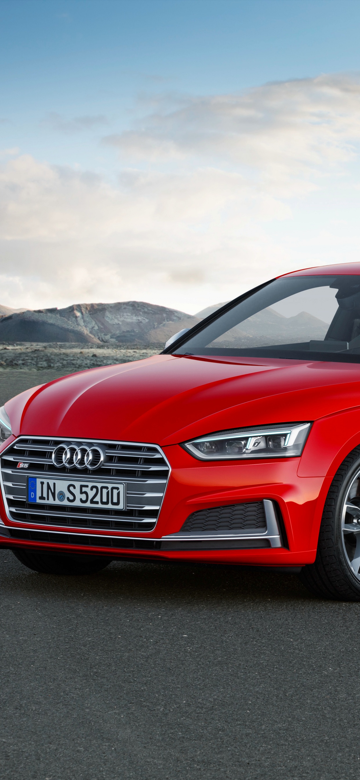Red Audi a 4 Sedan on a Gray Asphalt Road. Wallpaper in 1242x2688 Resolution