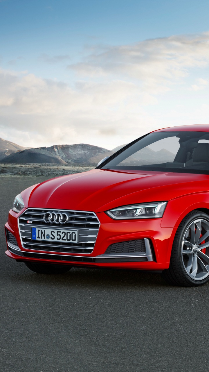 Red Audi a 4 Sedan on a Gray Asphalt Road. Wallpaper in 720x1280 Resolution