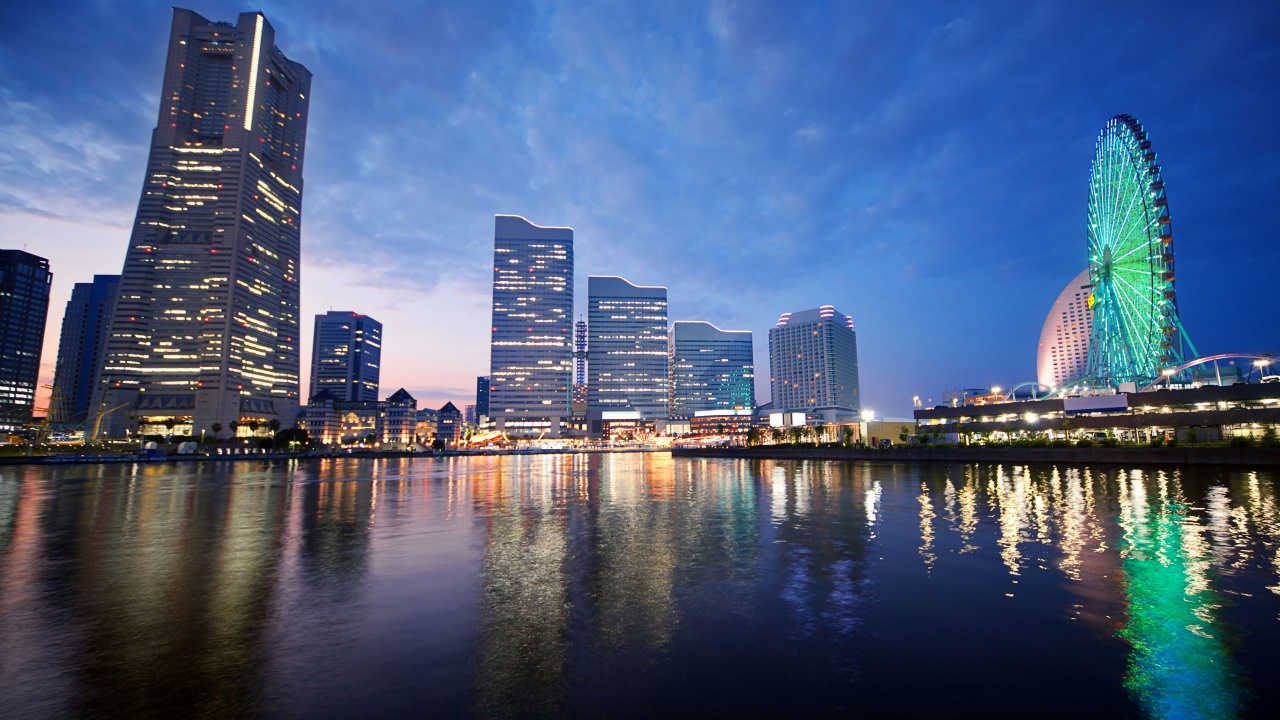 City Skyline Across Body of Water During Night Time. Wallpaper in 1280x720 Resolution