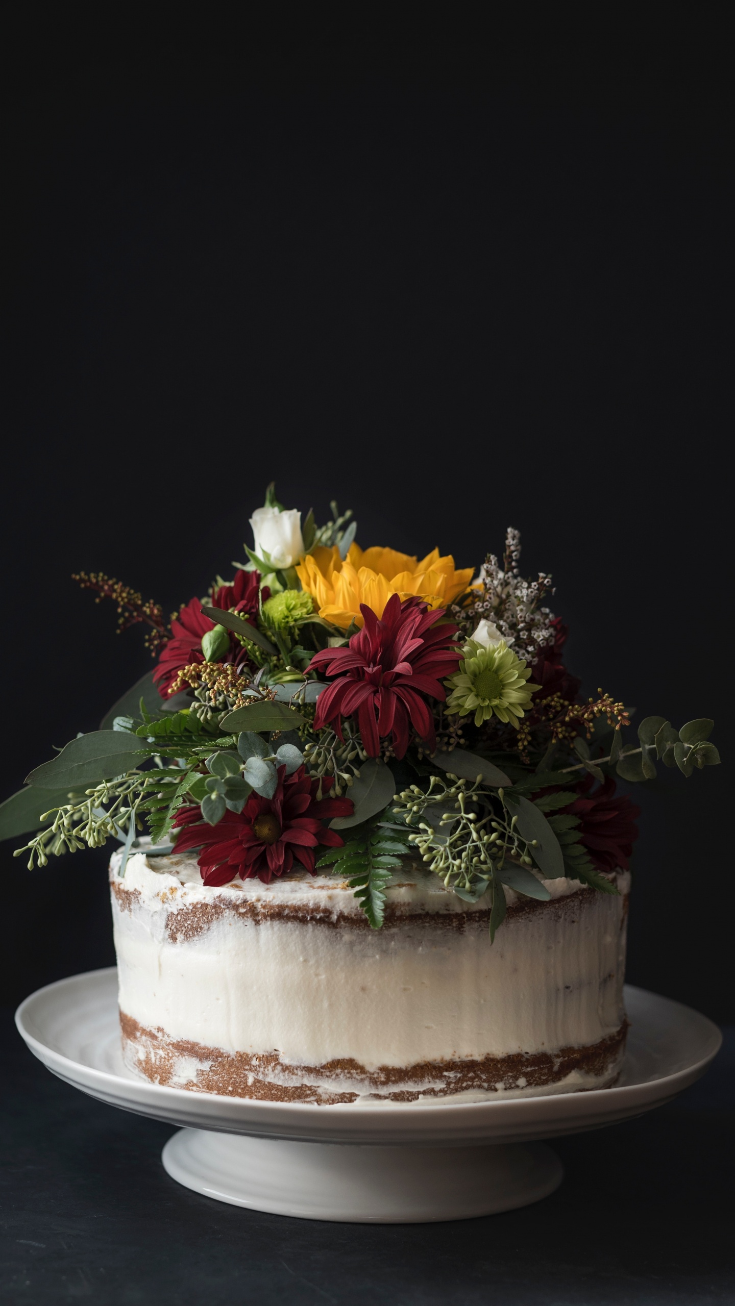 Yellow and Red Flowers on White Ceramic Vase. Wallpaper in 1440x2560 Resolution