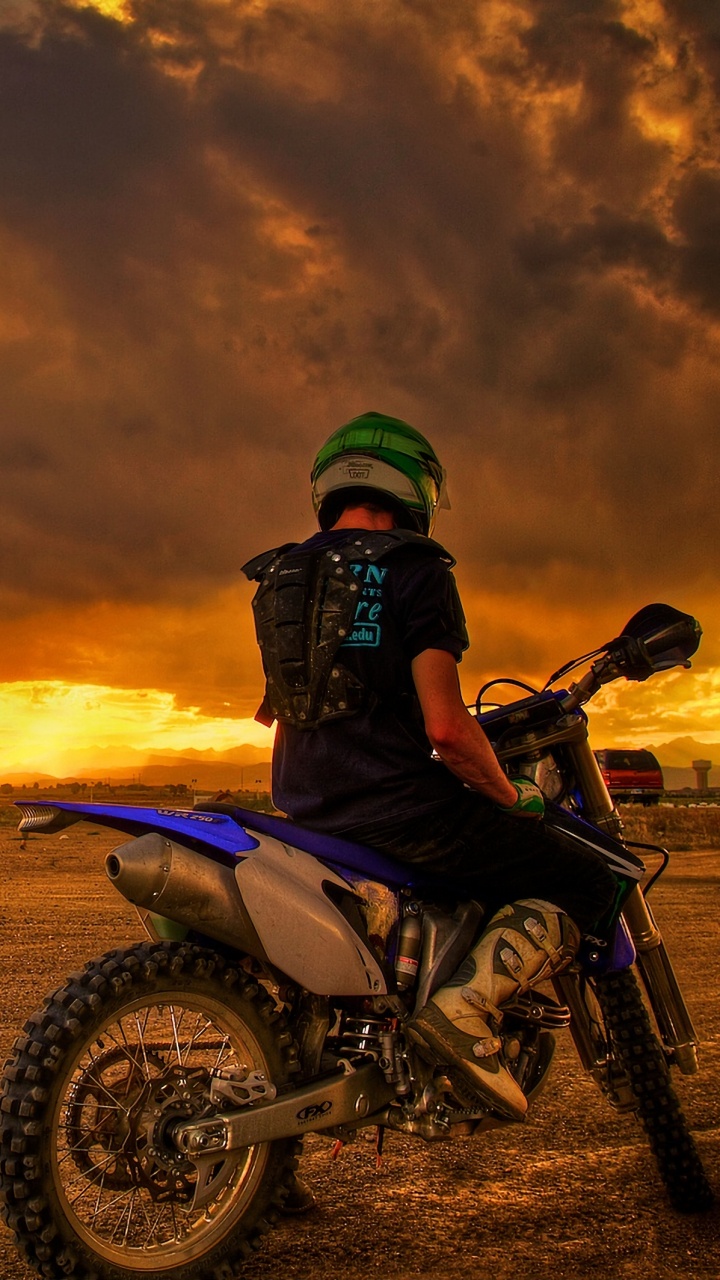 Man Riding Motorcycle on Brown Field During Sunset. Wallpaper in 720x1280 Resolution