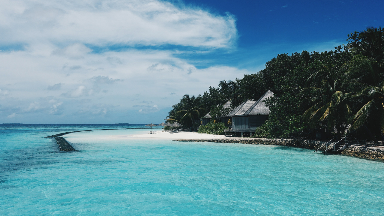 White and Brown House on Beach During Daytime. Wallpaper in 1280x720 Resolution