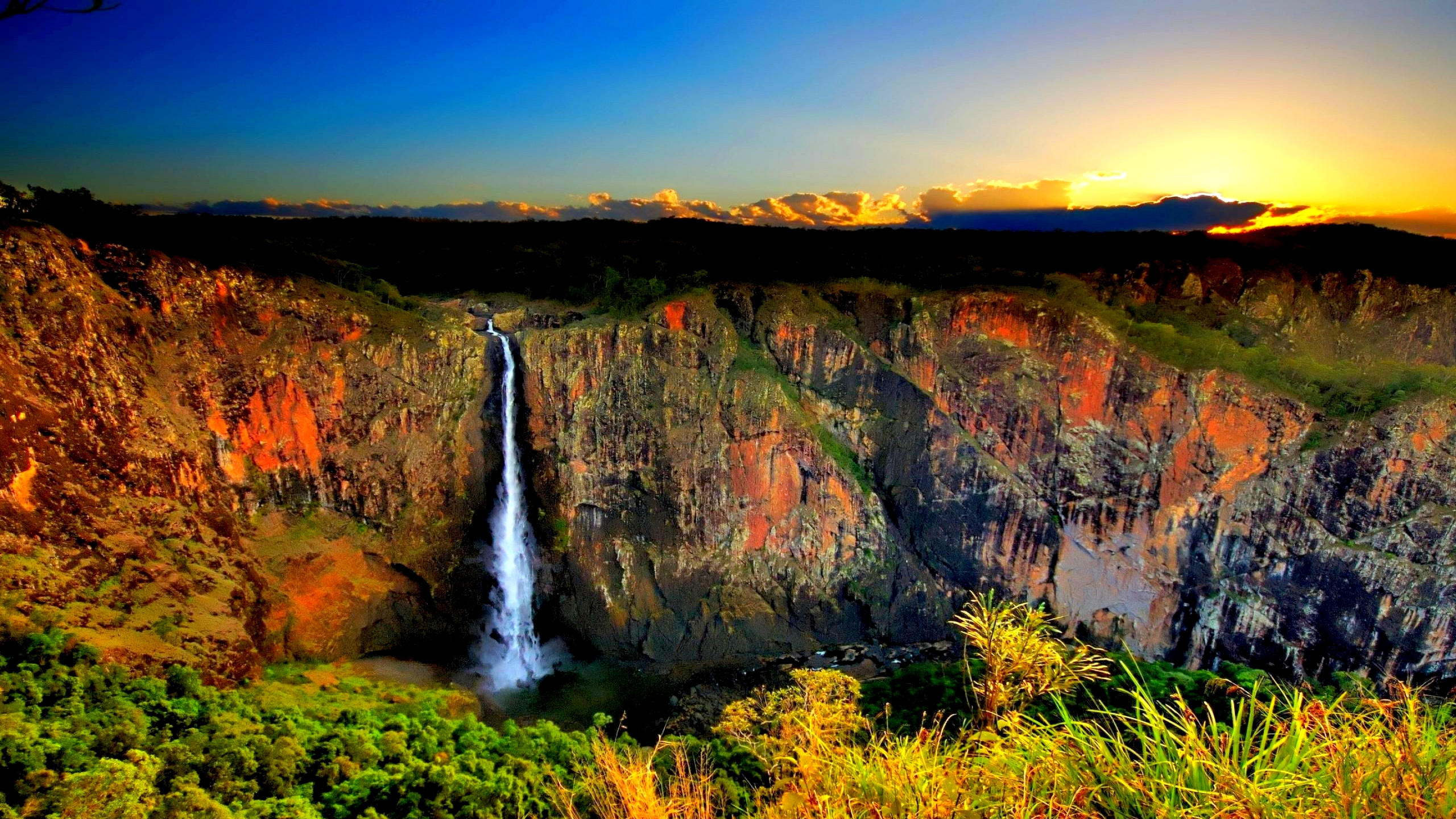 Waterfalls on Brown Rocky Mountain Under Blue Sky During Daytime. Wallpaper in 2560x1440 Resolution