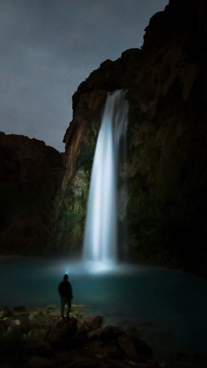 Man Standing on Rock Near Waterfalls During Daytime. Wallpaper in 720x1280 Resolution